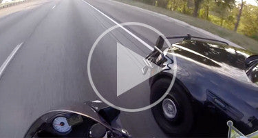 COP ALMOST HITS BIKE AT 125+ MPH