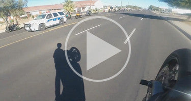 MOTORCYCLE STUNTER ANTAGONIZES POLICE