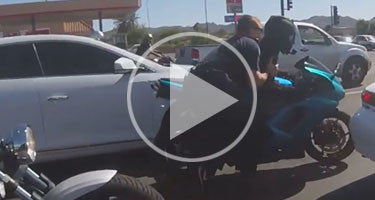 COP DRAGGED BY BIKER